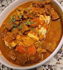 Braised Beef over Garlic Mash - $25