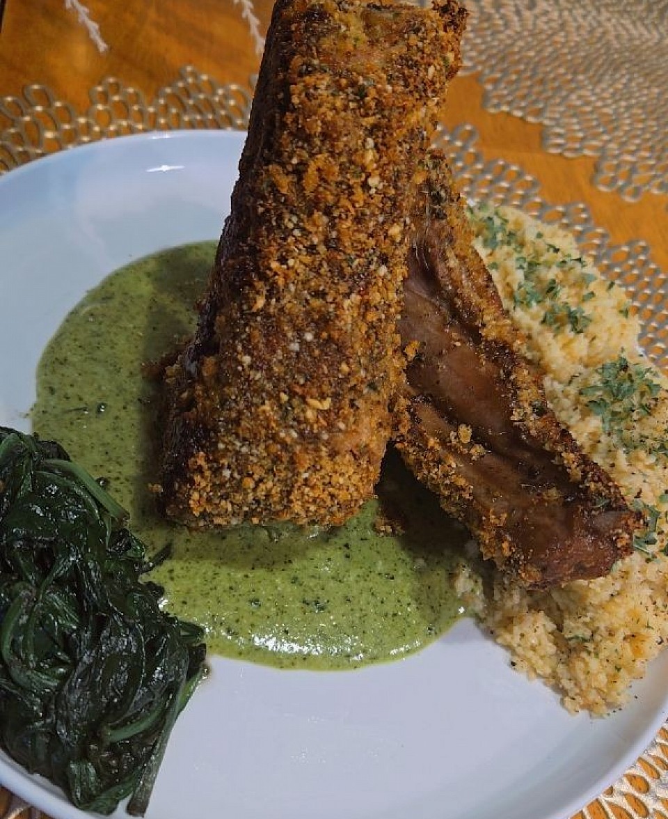 Pine nut parm crusted lamb chop w creamy sun flower seed pesto, buttery couscous and sauteed spinach -$50